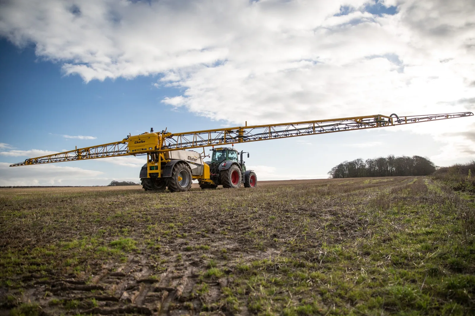 Sprayer working a field